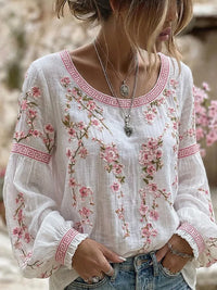 Blusa blanca con bordado floral rosa